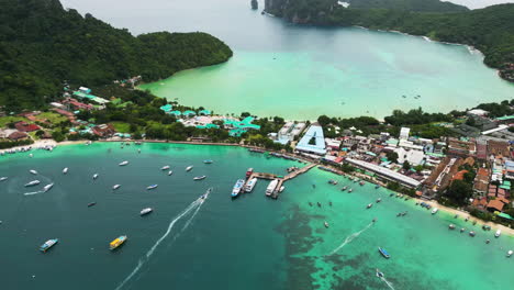 Exotic-township-of-Koh-with-sailing-boats,-aerial-hyper-lapse-view