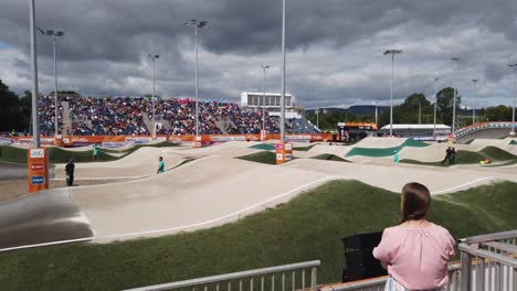 A-woman-watching-the-young-BMX-riders-at-the-UCI-Cycling-World-Championships-2023-BMX-Racing-in-Glasgow