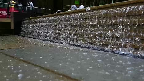 Water-falling-within-St-Pancras-Square,-London,-United-Kingdom