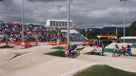 Slow-motion-of-young-female-riders-in-the-group-stages-of-the-UCI-BMX-racing-in-Glasgow