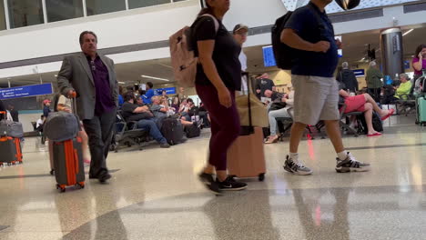 Foot-Traffic-of-Travelers-inside-International-Arrival-and-Departure-Terminals,-near-Gate-23A,-with-Suitcases-and-Luggage-at-LAX-Airport-on-7-13-2023
