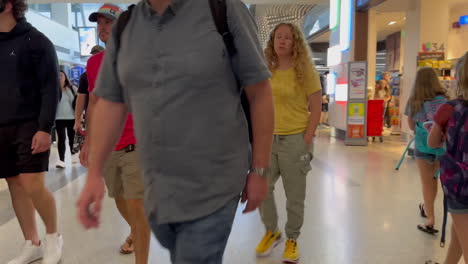 Traveler-Point-of-View-of-People-Walking-with-Suitcases-through-International-Arrivals-and-Departures-at-LAX-Airport-on-7-13-2023