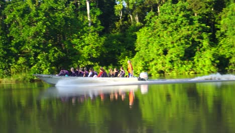 Tourists-On-Speedboat-Travelling-Along-Kinabatangan-River-In-Sabah,-Malaysia