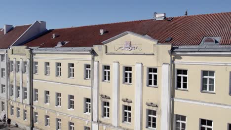 Drone-shot-of-Tartu-city-library-linna-raamatukogu-on-house-we-can-see-small-emblem-of-tartu