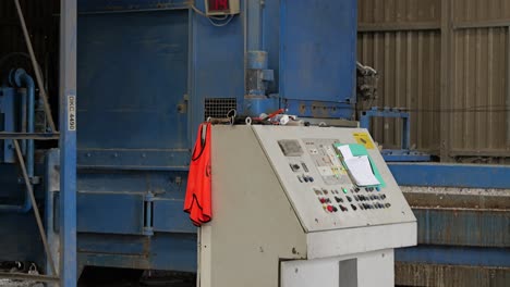 Close-up-of-control-console-at-paper-recycling-plant-for-controlling-machinery