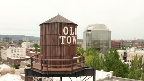 Circling-aerial-shot-of-Portland-Old-town-water-tank