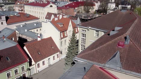 Drone-shot-of-Tartu-beautiful-medieval-old-houses-in-city-center-one-of-them-have-had-recently-fire