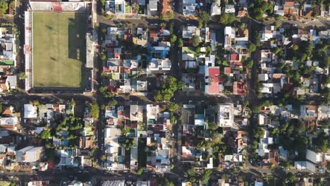 Top-down-aerial-image-of-a-city-in-the-interior-of-Argentina,-with-a-soccer-stadium