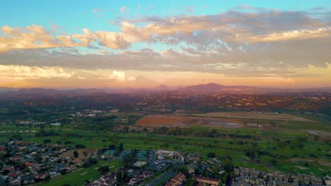 Air-Balloons-During-Sunset,-Magical-Sky-over-San-Diego,-Aerial-Panorama