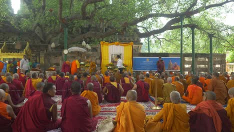Buddhist-monks-assembly-on-the-occasion-of-Holy-Dalai-Lama's-88th-birthday-at-the-sacred-Mahabodhi-Temple-World-Heritage-site,-Wide-Angle-shot