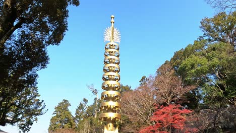 Golden-pagoda-poll-near-Todaiji-Buddhist-temple,-in-Nara,-Japan