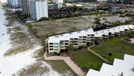 Aerial-view-Beach-service-chairs-and-umbrella-at-the-beach-resort-in-Destin,-Florida