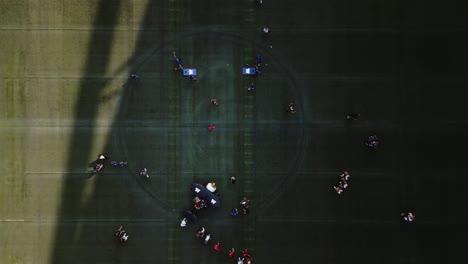 4K-Top-Down-Kids-Playing-Grass-Turf-Drone-Shot-of-IG-Investors-Group-Field-University-of-Manitoba-Winnipeg-Blue-Bombers-Football-and-Soccer-Concert-Stadium-Arena-in-Canada