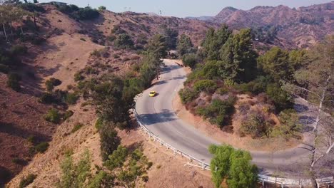 Roads-of-Hollywood-Hills,-Luxury-Sports-Car-Driving-on-windy-corners