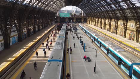 Interior-of-busy-Retiro-train-station-in-Buenos-Aires,-forward-aerial