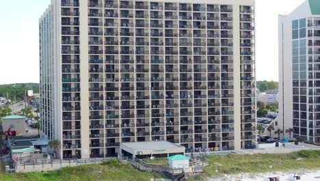 Aerial-view-of-Sundestin-Beach-Resort,-Destin,-Florida,-United-States-and-coastline-with-colorful-beach-chair,-umbrellas,-clouds-blue-sky,-Aerial-of-Gulf-of-Mexico-Travel-destination