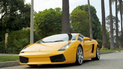 Lamborghini-Drives-Past-Camera,-Beverly-Hills,-California