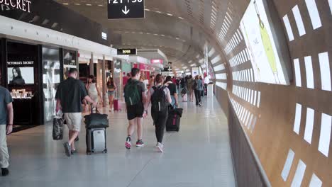 Inside-Paris-Charles-de-Gaulle-Airport:-Travelers-Waiting-at-Gates,-Pre-Flight-Activities,-Navigating-Lounges,-Duty-Free-Shops,-and-Boarding-Announcements