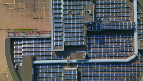 Solar-panels-on-top-of-a-circular-University-of-Helsinki-building-in-Viikki-campus-in-Helsinki,-Finland