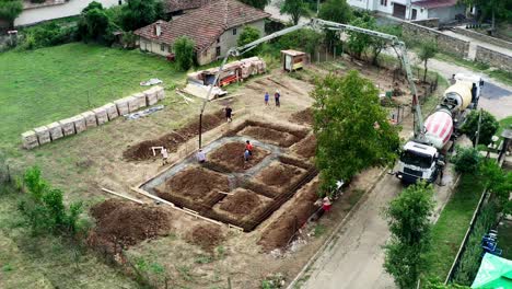 Foundation-trench-for-house-filled-with-ready-mixed-concrete-drone-view