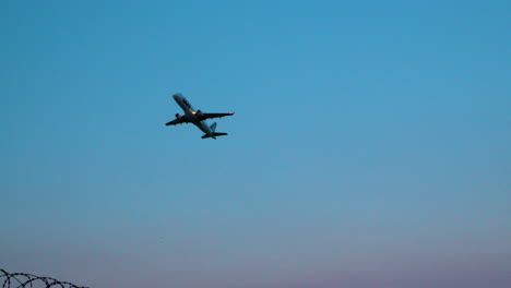 Polish-LOT-Airlines-plane-takes-off-from-airport-in-Warsaw-in-evening