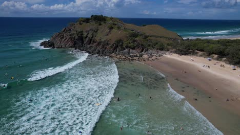 Norries-Head-And-Cabarita-Beach-With-Surfers-In-New-South-Wales,-Australia---aerial-drone-shot