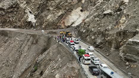 Aerial-View-Of-Traffic-Queue-Behind-Bulldozer-As-It-Clears-Landslide-On-Skardu-Road-Which-Links-Pakistan-Cities-Of-Gilgit-and-Skardu-in-Gilgit−Baltistan