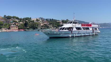 Ferry-boats-navigating-on-the-beautiful-Mediterranean-water-of-Santa-Margherita-Ligure,-Italy