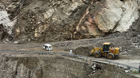 Aerial-View-Of-Bulldozer-Clearing-Land-Slide-On-Skardu-Road
