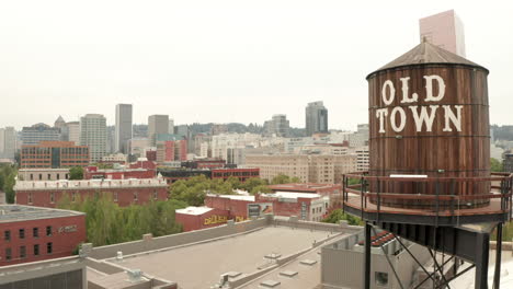 Rising-aerial-shot-of-Portland-Old-town-water-tank-revealing-the-city-centre