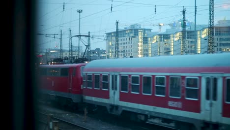 Passengers-view-outside-window-of-an-driving-train-through-Frankfurt-city