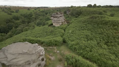 4k-Aerial-footage-of-Bridstones-sandstone-rock-formations-in-Dalby-Forest,-North-Yorkshire