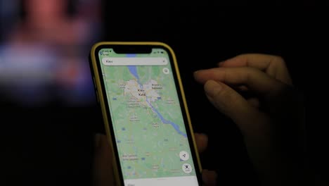 Scrolling,-searching-and-finding-destination-of-Kiev,-Ukraine-on-phone-map