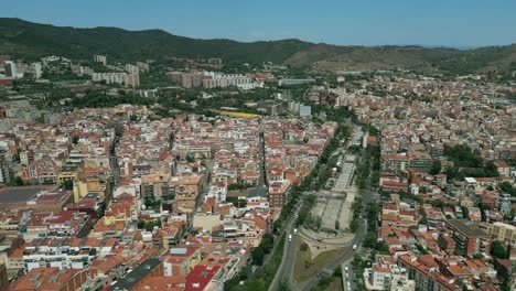 An-aerial-drone-shot-of-a-wide-road-in-the-center-of-Barcelona-city