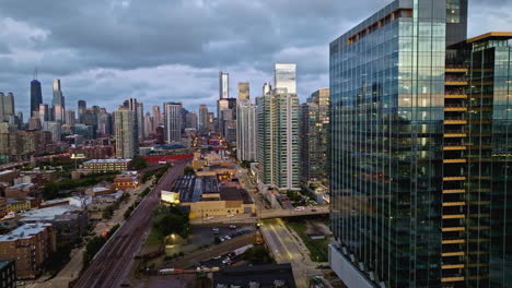 Aerial-pan-shot-of-the-new-360-North-Green-high-rise,-cloudy-morning-in-Chicago,-USA