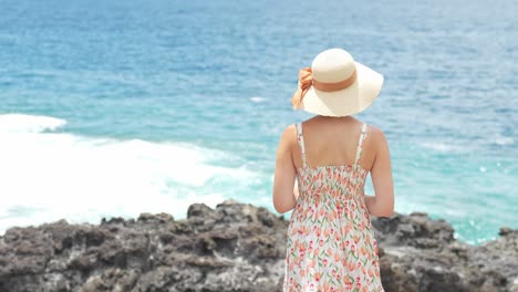 Beautiful-rear-view-of-woman-tourist-enjoying-sea-view,-summer-outfit,-Tenerife