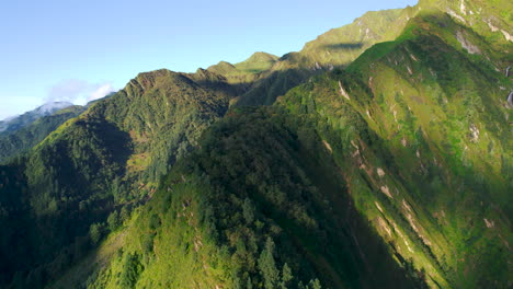 Forward-moving-drone-shot-of-Nepal's-landscape,-high-hills,-cliffs-at-sunrise