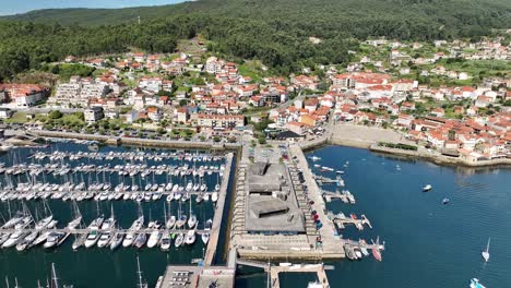 Orbiting-View-of-Combarro-Harbor:-Yachts-and-Arriving-Boat