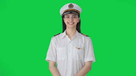 Happy-Indian-woman-pilot-smiling-to-the-camera-Green-screen