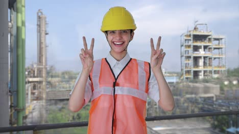 Happy-Indian-female-architect-showing-victory-sign