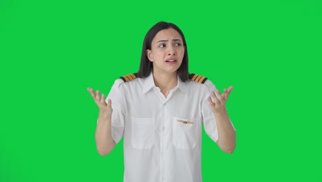 Shocked-Indian-woman-pilot-looking-at-something-Green-screen