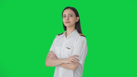 Portrait-of-Indian-woman-pilot-crossed-hands-Green-screen