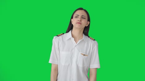 Confused-Indian-woman-pilot-looking-here-and-there-Green-screen