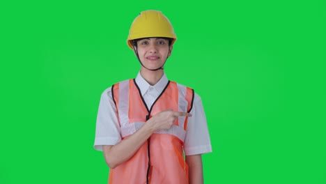 Happy-Indian-female-architect-explaining-the-work-to-employees-Green-screen