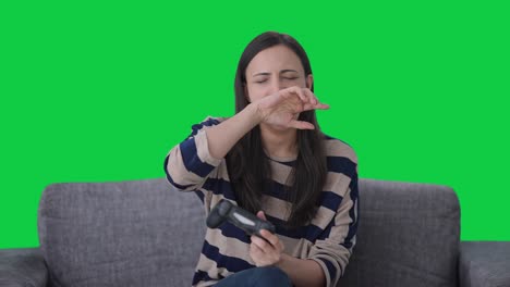 Tired-Indian-girl-gamer-playing-video-games-Green-screen