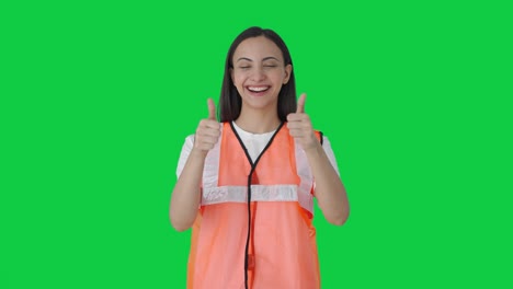 Happy-Indian-airport-ground-staff-girl-showing-thumbs-up--Green-screen
