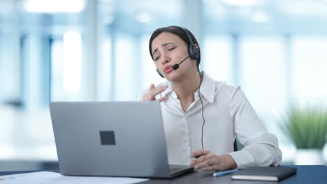 Stressed-Indian-call-center-girl-talking-to-customer-through-video-call