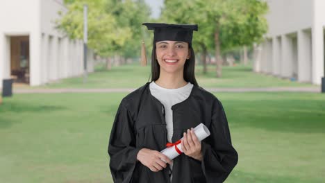 Happy-Indian-college-graduate-girl-holding-degree
