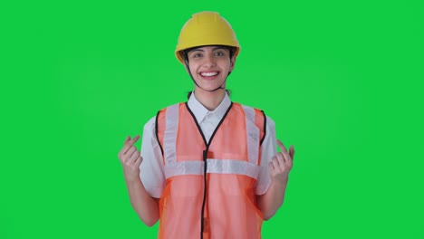 Happy-Indian-female-architect-talking-Green-screen