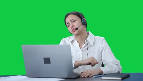 Stressed-Indian-call-center-girl-talking-to-customer-through-call-Green-screen